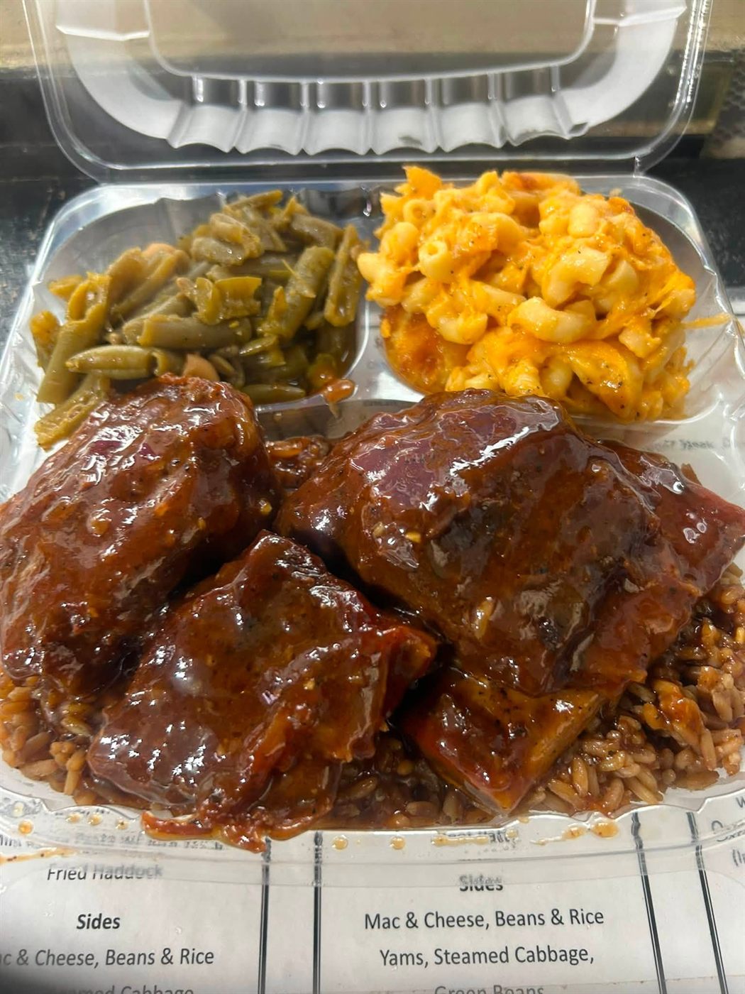 Large beef rib dinner, glazed ribs over rice with green beans and macaroni & cheese